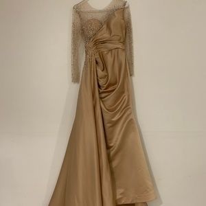 This is a gold custom made gown from a Lebanese designer. Only wore once